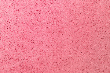 Rough pink wall texture background.