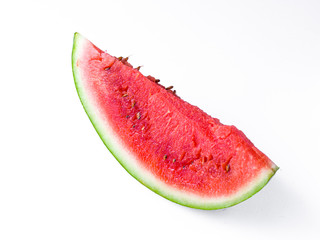 Sliced Watermelon on white plate with spoon and fork stock photo with bright background.
