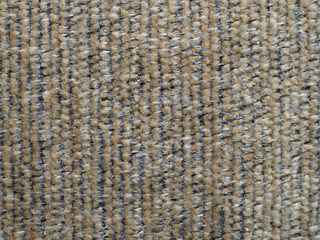 Gray-beige, hairy striped material with visible texture. background or texture, closeup.