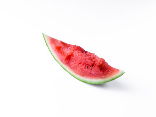 Sliced Watermelon on white plate with spoon and fork stock photo with bright background.
