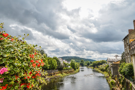 View of the river Dordogne at Bort les Orgues, a little french village in Correze, Auvergne. The beauty of the river in a very cloudy day.