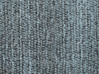 Gray hairy fabric with stripes and visible texture. background or texture, closeup.