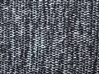 Black and white, hairy fabric with stripes and visible texture. background or texture, closeup.