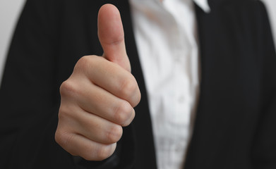 Business woman showing thumb up 