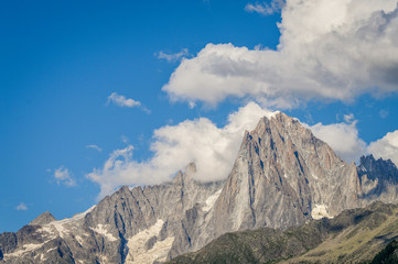 French Alps mountains in a cloudy summer day, seen from Les Houches near Chamonix, Haute Savoy, France.