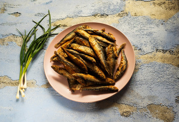 Fried herring on a plate - 342836489