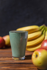 promotional shooting of a fruit cocktail for a healthy eating establishment. In the photo, a glass with a green drink made from fruits and algae spirulina powder
