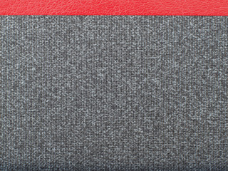 Gray fabric with a red stripe.