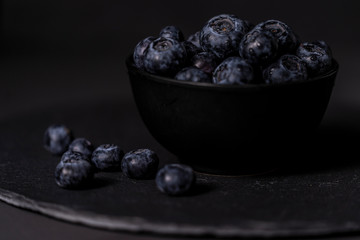 Fresh blueberry bowl. Dark food photography