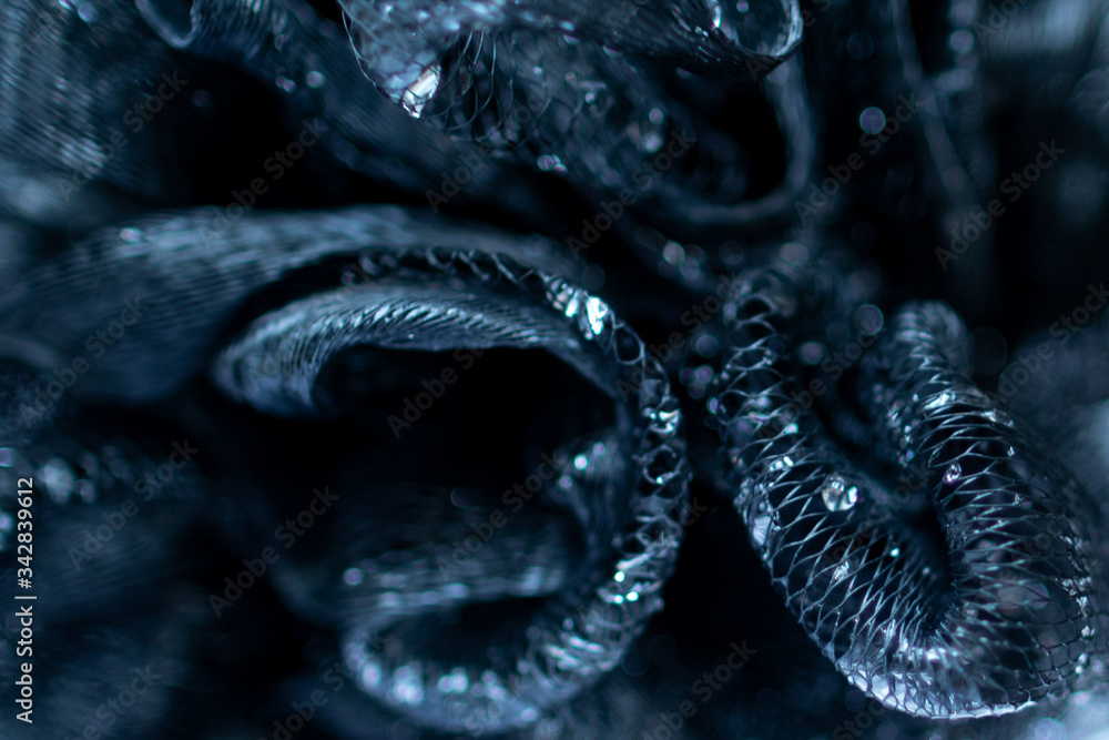 Wall mural background and backsplash of wet net with moist crystal water drops stuck between strings - abstract