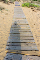 Fototapeta premium boardwalk leading to the beach on the sand