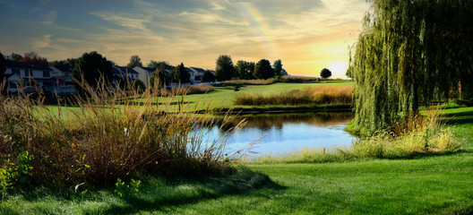 Peaceful view of a golf course during sunset