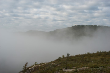 misty summer dawn in the low mountains