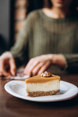 delicious caramelized nut cheesecake on the table in cafe