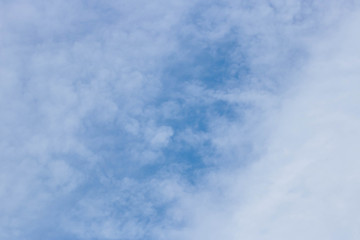 Fototapeta premium Bright blue sky with fluffy white clouds. Clearing day and Good weather. Blue sky background.