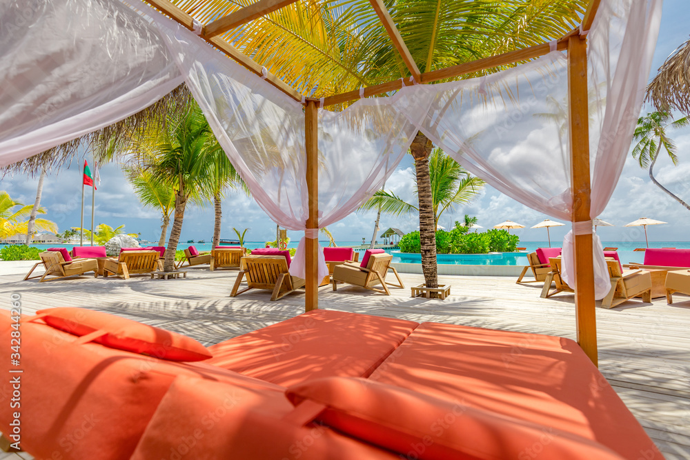 Wall mural white beach canopies. luxury beach tents at a resort. wonderful view of beach scenery, luxury vacati