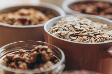 a delicious and crunchy oatmeal granola with honey, nuts, dried fruits and grains. Dynamic healthy food photography