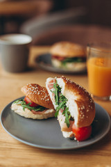 delicious and appetizing breakfast: a bagel stuffed on a plate