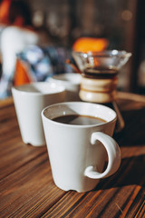 The coffee is alternatively made using a paper filter and a kemex is poured from the flask into a mug. Third wave cafe