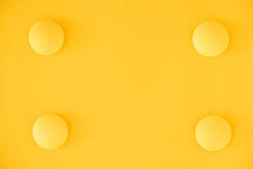 Yellow balls on yellow background. Minimal concept. Top view. Copy, empty space for text
