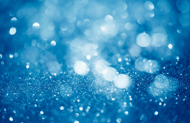 blue defocused glitter background with copy space