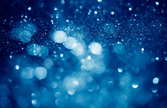 blue defocused glitter background with copy space