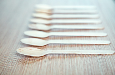 no plastic, clean, disposable food appliances, light wood spoons, with space for text and space for...