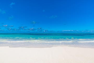 Sea sand sky concept. Closeup of sand on beach and blue summer sky, calmness and inspiration nature concept
