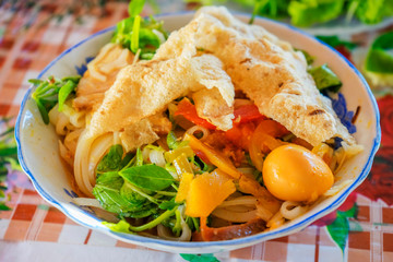 Vietnamese noodle Mi Quang at Tra Que vegetable village, Hoi An old town, Vietnam