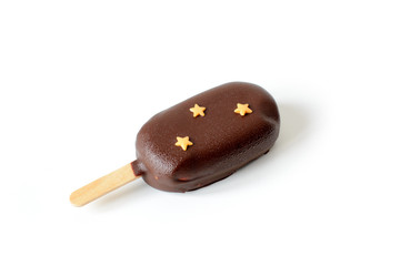 Chocolate popsicle ice cream decorated with three stars isolated on white background