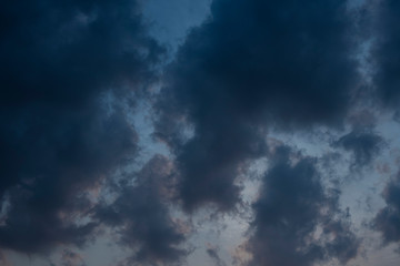Beautiful clouds roaming in the red and bluish sky during sunset in the afternoon. Indian landscape and sky.