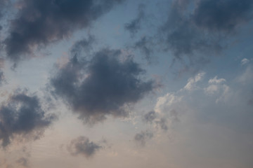 Beautiful clouds roaming in the red and bluish sky during sunset in the afternoon. Indian landscape and sky.
