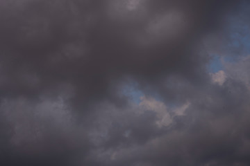 Beautiful clouds roaming in the red and bluish sky during sunset in the afternoon. Indian landscape and sky.