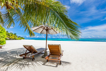 Exotic travel and vacation destination, summer landscape with beach chairs and umbrella. Luxury...