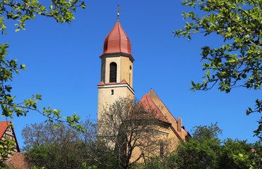 church in a Bavarian village, framed by trees