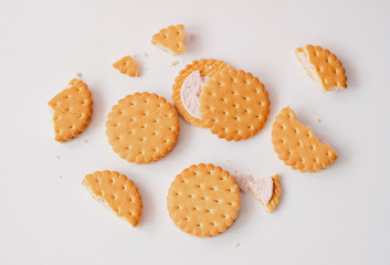 Sweet creamy filling crackers isolated on a white pastel background. Flat lay 