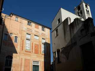 Fototapeta na wymiar Beautiful corner with Renaissance palace and medieval church. City of Genoa. Liguria. Italy.