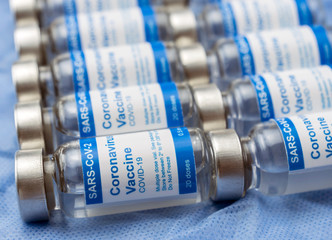 Coronavirus covid-19 experimental vaccine in a laboratory, conceptual image