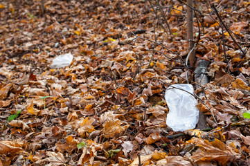 Plastic waste thrown out in the forest