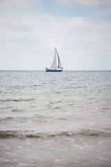 Obraz premium Sailing boat on the mediterranean coast