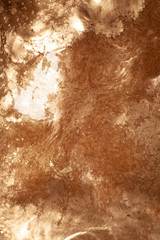 Gold chemical dirty colored water background close up