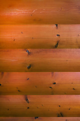 wooden log orange texture with rope seam close up