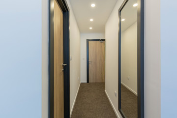 Doorway corridor interior in apartment building