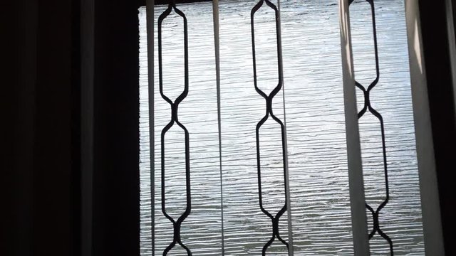 glass window being closed by blind curtain, concept of fear, tension, dark, domestic life