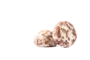 Two glazed gingerbreads with fruit filling isolated on a white background.