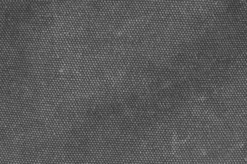 Fragment of a textile backpack with zippers and zippers. Textured pattern of coarse interwoven threads.