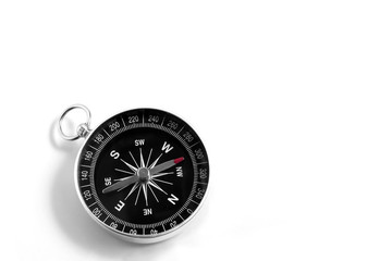 Closeup compass isolated on a white background. Travel geography navigation. Copy space