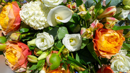 Wonderful bouquet with orange peonies and various flowers. Spring and colorful composition