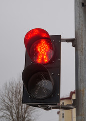 glowing red traffic light in the daytime