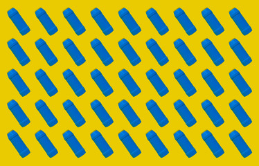 Pattern of plastic bottles on a colored background. Background of plastic bottles. Snippet from the...